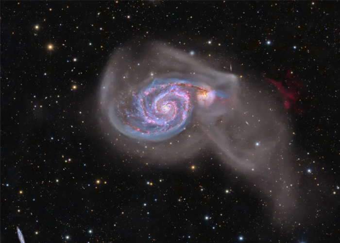 NASA Spotlight: Spiral Galaxy and Its Neighbor Make Astronomical Photo of the Day